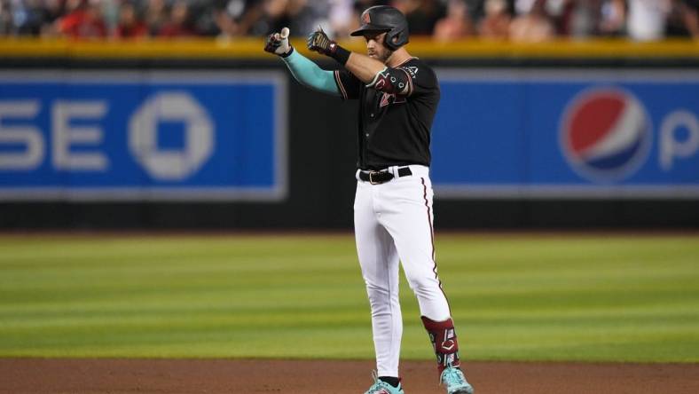 iJul 24, 2023; Phoenix, Arizona, USA; Arizona Diamondbacks third baseman Evan Longoria (3) reacts after hitting a two RBI double against the St. Louis Cardinals during the seventh inning at Chase Field. Mandatory Credit: Joe Camporeale-USA TODAY Sports