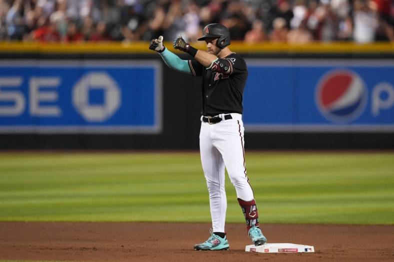 iJul 24, 2023; Phoenix, Arizona, USA; Arizona Diamondbacks third baseman Evan Longoria (3) reacts after hitting a two RBI double against the St. Louis Cardinals during the seventh inning at Chase Field. Mandatory Credit: Joe Camporeale-USA TODAY Sports