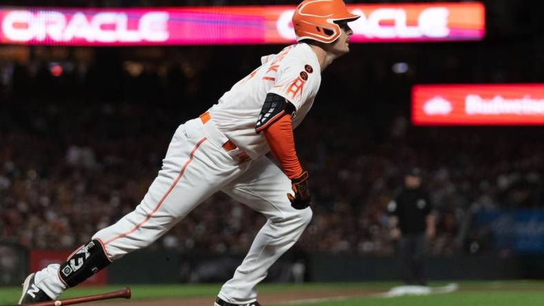 Jul 25, 2023; San Francisco, California, USA;  San Francisco Giants center fielder Mike Yastrzemski (5) runs to first base during the eighth inning against the Oakland Athletics at Oracle Park. Mandatory Credit: Stan Szeto-USA TODAY Sports