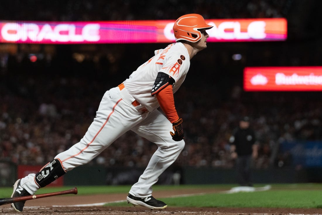 Jul 25, 2023; San Francisco, California, USA;  San Francisco Giants center fielder Mike Yastrzemski (5) runs to first base during the eighth inning against the Oakland Athletics at Oracle Park. Mandatory Credit: Stan Szeto-USA TODAY Sports