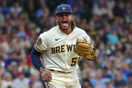Jul 26, 2023; Milwaukee, Wisconsin, USA; Milwaukee Brewers pitcher Freddy Peralta (51) reacts after striking out Cincinnati Reds shortstop Matt McLain (9) in the sixth inning at American Family Field. Mandatory Credit: Benny Sieu-USA TODAY Sports