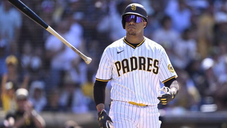 Jul 26, 2023; San Diego, California, USA; San Diego Padres left fielder Juan Soto (22) tosses his bat after a bases-loaded walk against the Pittsburgh Pirates during the ninth inning at Petco Park. Mandatory Credit: Orlando Ramirez-USA TODAY Sports