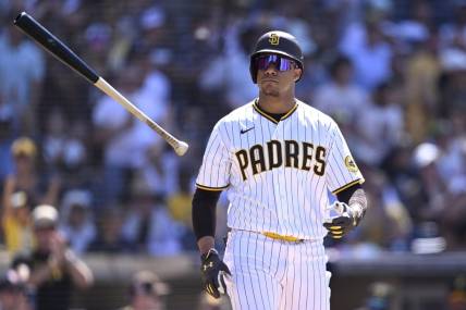 Jul 26, 2023; San Diego, California, USA; San Diego Padres left fielder Juan Soto (22) tosses his bat after a bases-loaded walk against the Pittsburgh Pirates during the ninth inning at Petco Park. Mandatory Credit: Orlando Ramirez-USA TODAY Sports