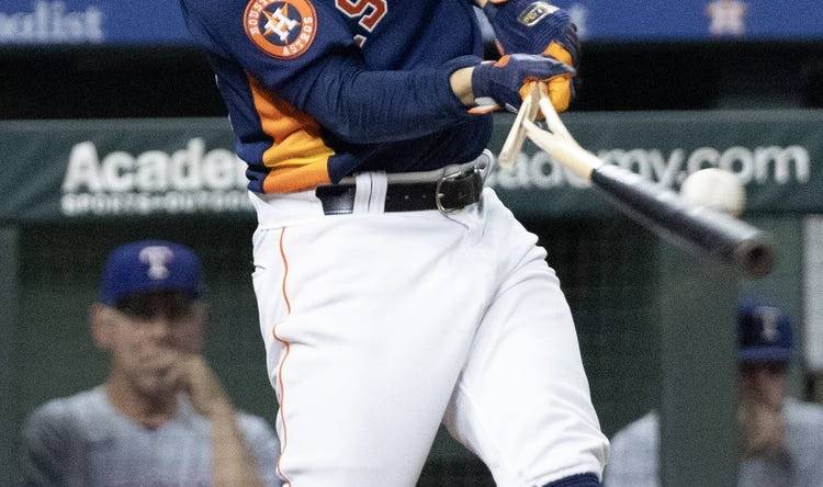 Jul 26, 2023; Houston, Texas, USA;  Houston Astros second baseman Jose Altuve (27) breaks his bat on a foul ball against the Texas Rangers in the third inning at Minute Maid Park. Mandatory Credit: Thomas Shea-USA TODAY Sports