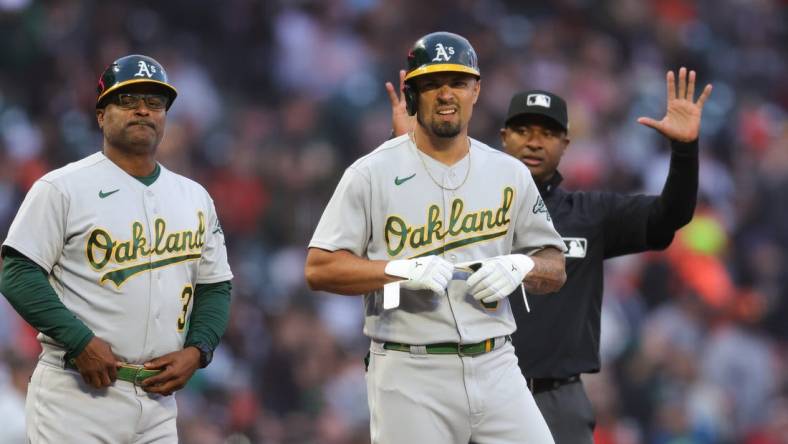 Jul 26, 2023; San Francisco, California, USA;  Oakland Athletics third baseman Jace Peterson (6) hits a two-RBI triple during the fourth inning against the San Francisco Giants at Oracle Park. Mandatory Credit: Sergio Estrada-USA TODAY Sports