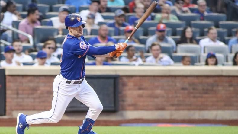 Jul 27, 2023; New York City, New York, USA; New York Mets left fielder Mark Canha (19) hits a single in the second inning against the Washington Nationals at Citi Field. Mandatory Credit: Wendell Cruz-USA TODAY Sports