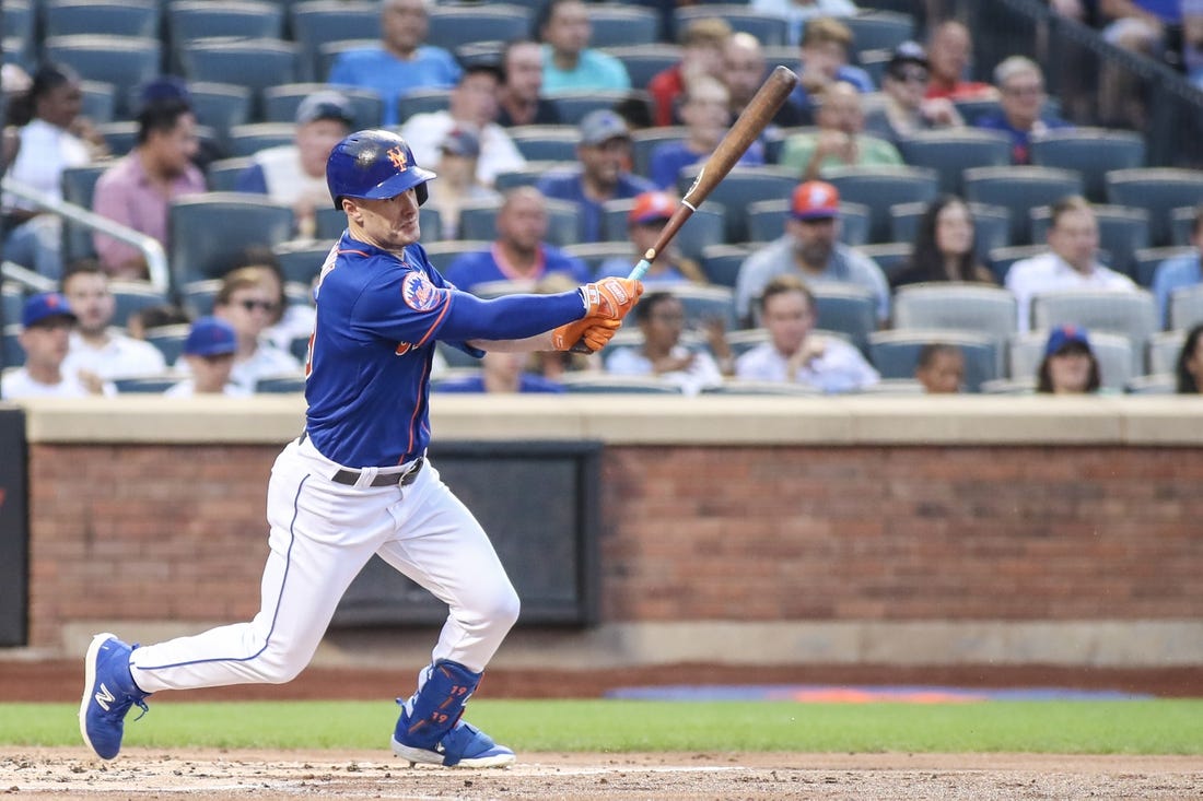 Jul 27, 2023; New York City, New York, USA; New York Mets left fielder Mark Canha (19) hits a single in the second inning against the Washington Nationals at Citi Field. Mandatory Credit: Wendell Cruz-USA TODAY Sports