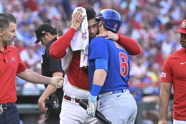 Cubs' Happ hits Cardinals catcher Contreras in head with follow