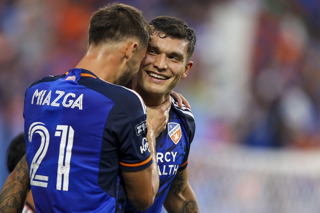 Jul 27, 2023; Cincinnati, OH, USA; FC Cincinnati forward Brandon Vazquez (19) reacts after scoring a goal with defender Matt Miazga (21) in the first half after the game at TQL Stadium. Mandatory Credit: Katie Stratman-USA TODAY Sports