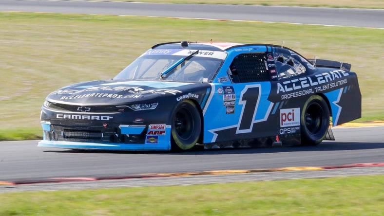 Sam Mayer (1) exits turn 3 during qualifying for the Road America 180, in the NASCAR Xfinity Series at Road America, Friday, July 28, 2023, near Plymouth, Wis.