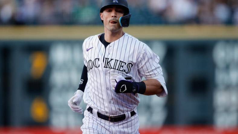 Jul 28, 2023; Denver, Colorado, USA; Colorado Rockies right fielder Randal Grichuk (15) rounds the bases on a solo home run in the fourth inning against the Oakland Athletics at Coors Field. Mandatory Credit: Isaiah J. Downing-USA TODAY Sports