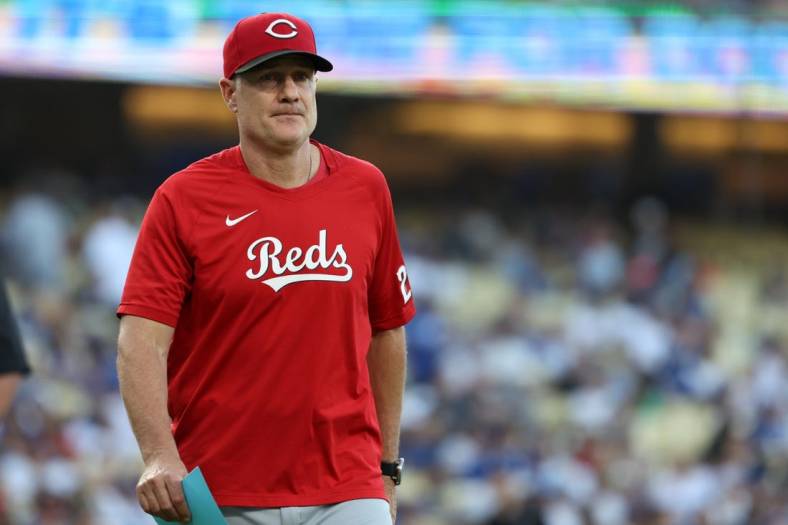 Jul 28, 2023; Los Angeles, California, USA; Cincinnati Reds manager David Bell (25) walks back to the dugout before the game against the Los Angeles Dodgers at Dodger Stadium. Mandatory Credit: Kiyoshi Mio-USA TODAY Sports