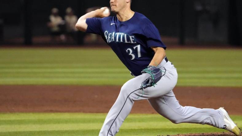 Jul 28, 2023; Phoenix, Arizona, USA; Seattle Mariners relief pitcher Paul Sewald (37) pitches against the Arizona Diamondbacks during the ninth inning at Chase Field. Mandatory Credit: Joe Camporeale-USA TODAY Sports