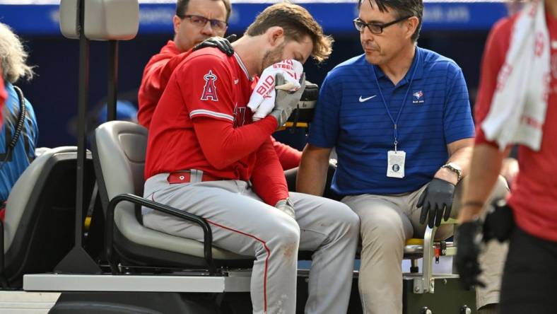 Jul 29, 2023; Toronto, Ontario, CAN;  Los Angeles Angels left fielder Taylor Ward (3) is taken off the field on a cart after being struck on the head by a pitch thrown by Toronto Blue Jays pitcher Alek Manoah in the fifth inning at Rogers Centre. Mandatory Credit: Dan Hamilton-USA TODAY Sports