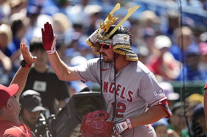 Los Angeles Angels' Hunter Renfroe, right, celebrates hitting a