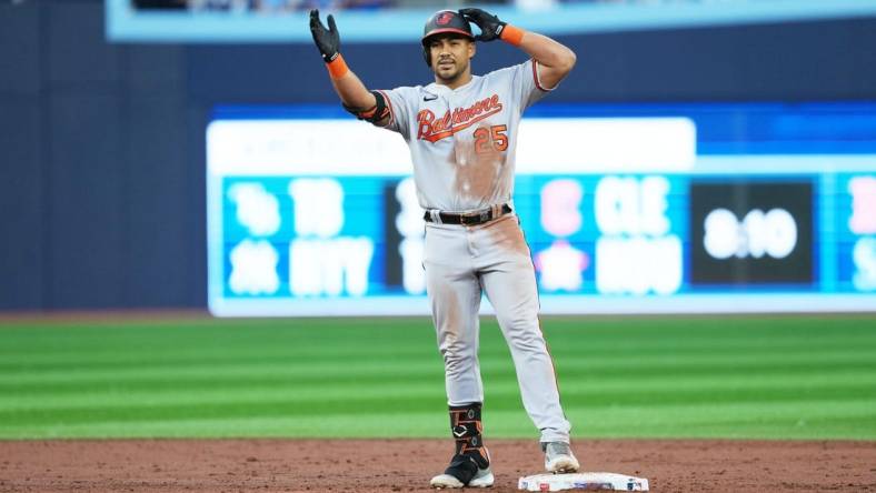 Jul 31, 2023; Toronto, Ontario, CAN; Baltimore Orioles right fielder Anthony Santander (25) celebrates hitting a double against the Toronto Blue Jays during the third inning at Rogers Centre. Mandatory Credit: Nick Turchiaro-USA TODAY Sports