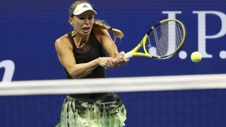 Aug 29, 2019; Flushing, NY, USA; Caroline Wozniacki of Denmark hits a backhand against Danielle Collins of the United States (not pictured) in the second round on day four of the 2019 U.S. Open tennis tournament at USTA Billie Jean King National Tennis Center. Mandatory Credit: Geoff Burke-USA TODAY Sports