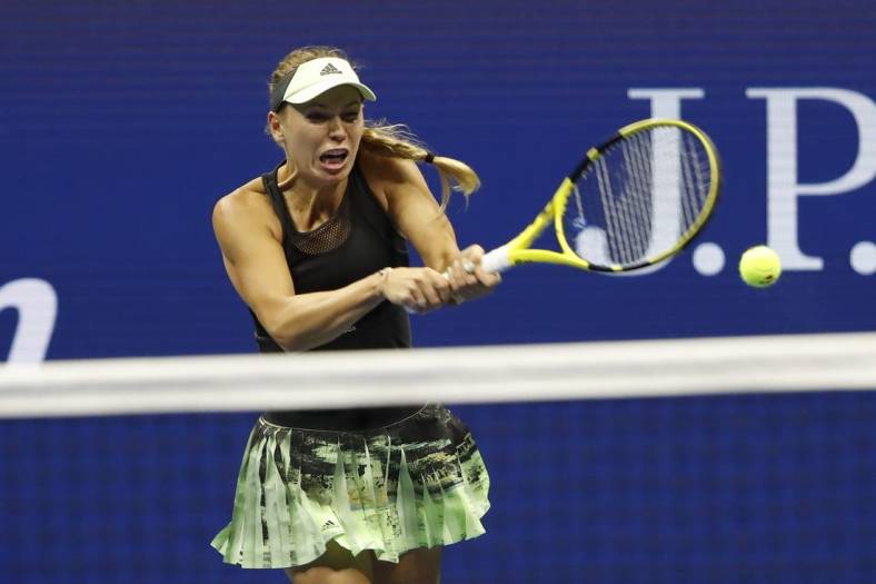 Aug 29, 2019; Flushing, NY, USA; Caroline Wozniacki of Denmark hits a backhand against Danielle Collins of the United States (not pictured) in the second round on day four of the 2019 U.S. Open tennis tournament at USTA Billie Jean King National Tennis Center. Mandatory Credit: Geoff Burke-USA TODAY Sports