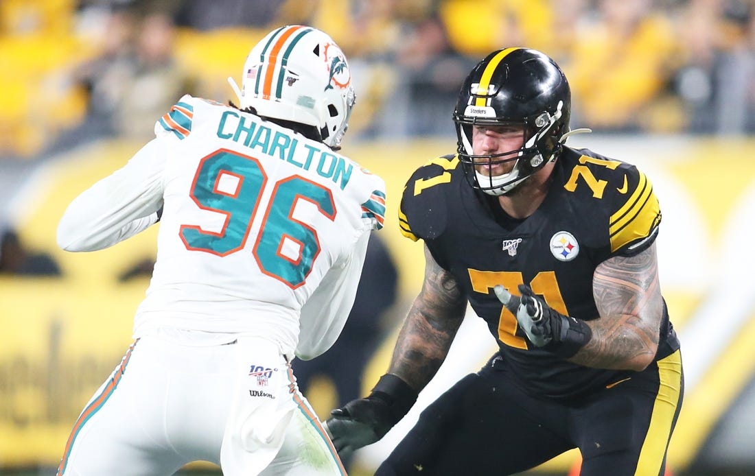 Oct 28, 2019; Pittsburgh, PA, USA;  Pittsburgh Steelers offensive tackle Matt Feiler (71) blocks at the line of scrimmage against Miami Dolphins defensive end Taco Charlton (96) during the second quarter at Heinz Field. The Steelers won 27-14. Mandatory Credit: Charles LeClaire-USA TODAY Sports