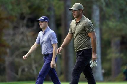 Nov 13, 2020; Augusta, Georgia, USA; Brooks Koepka and Justin Thomas walk up the 14th fairway during the second round of The Masters golf tournament at Augusta National GC. Mandatory Credit: Rob Schumacher-USA TODAY Sports