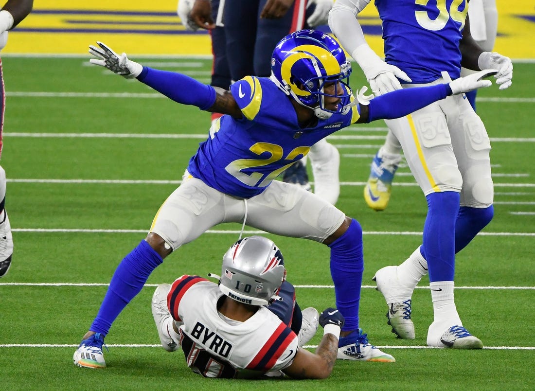 Dec 10, 2020; Inglewood, California, USA; Los Angeles Rams cornerback Troy Hill (22) signals incomplete pass after breaking up a pass play to New England Patriots wide receiver Damiere Byrd (10) during the first quarter at SoFi Stadium. Mandatory Credit: Robert Hanashiro-USA TODAY Sports