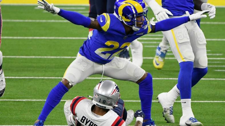 Dec 10, 2020; Inglewood, California, USA; Los Angeles Rams cornerback Troy Hill (22) signals incomplete pass after breaking up a pass play to New England Patriots wide receiver Damiere Byrd (10) during the first quarter at SoFi Stadium. Mandatory Credit: Robert Hanashiro-USA TODAY Sports