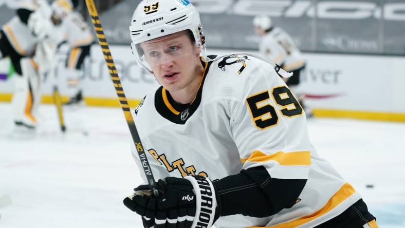 Apr 3, 2021; Boston, Massachusetts, USA; Pittsburgh Penguins left wing Jake Guentzel (59) warms up before the start of the game against the Boston Bruins at TD Garden. Mandatory Credit: David Butler II-USA TODAY Sports