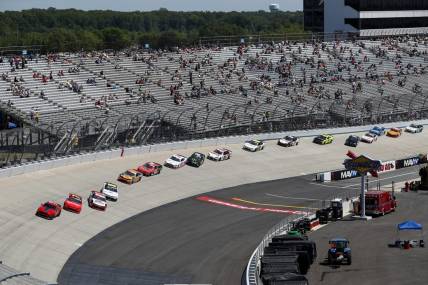 May 15, 2021; Dover, DE, USA; NASCAR XFINITY Series cars sit on the racetrack under a red flag during the Drydene 200 at Dover International Speedway. Mandatory Credit: Matthew OHaren-USA TODAY Sports
