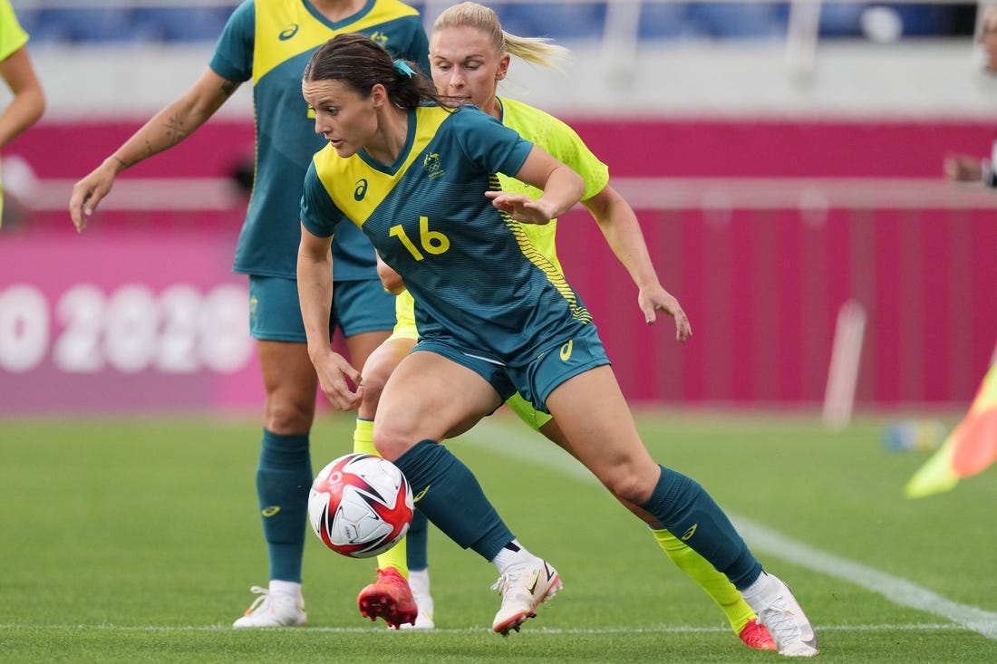 Jul 24, 2021; Saitama, Japan; Australia player Hayley Raso (16) moves the ball agains Sweden player Jonna Andersson (2) during the Tokyo 2020 Olympic Summer Games at Saitama Stadium. Mandatory Credit: Jack Gruber-USA TODAY Network