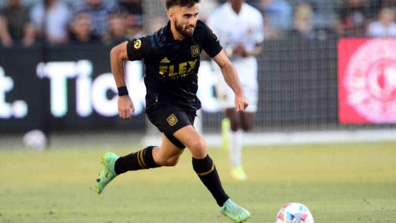 Aug 28, 2021; Los Angeles, CA, Los Angeles, CA, USA; Los Angeles FC forward Diego Rossi (9) moves the ball against the Los Angeles Galaxy during the second half at Banc of California Stadium. Mandatory Credit: Gary A. Vasquez-USA TODAY Sports