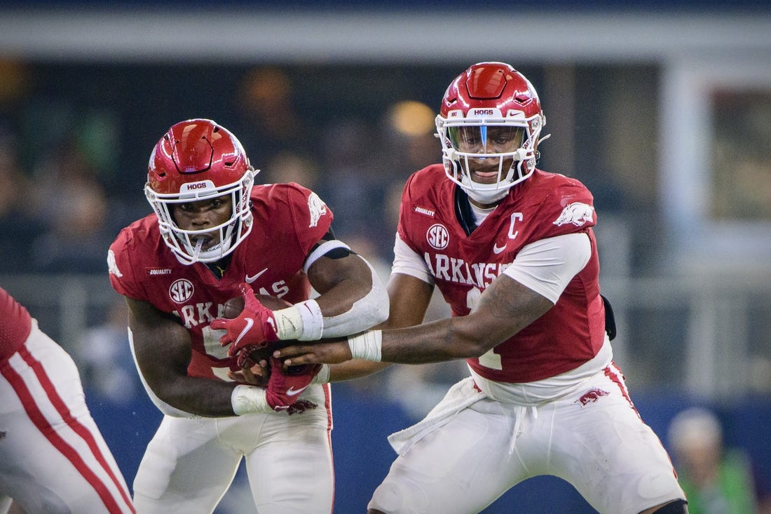 Sep 25, 2021; Arlington, Texas, USA; Arkansas Razorbacks quarterback KJ Jefferson (1) hands off to running back Raheim Sanders (5) during the second half at AT&T Stadium. Mandatory Credit: Jerome Miron-USA TODAY Sports