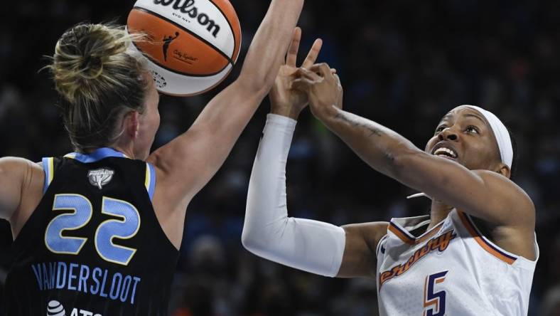 Oct 15, 2021; Chicago, Illinois, USA; Chicago Sky guard Courtney Vandersloot (22) blocks Phoenix Mercury guard Shey Peddy (5) during the first half of game three of the 2021 WNBA Finals at Wintrust Arena. Mandatory Credit: Matt Marton-USA TODAY Sports