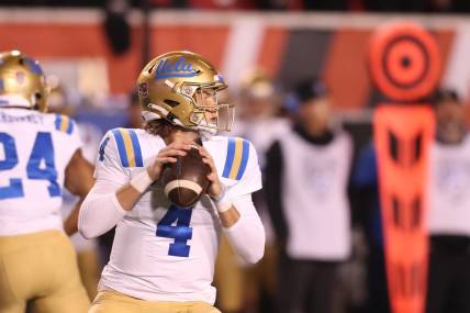 Oct 30, 2021; Salt Lake City, Utah, USA; UCLA Bruins quarterback Ethan Garbers (4) drops back to pass the ball during the first quarter against the Utah Utes at Rice-Eccles Stadium. Mandatory Credit: Rob Gray-USA TODAY Sports