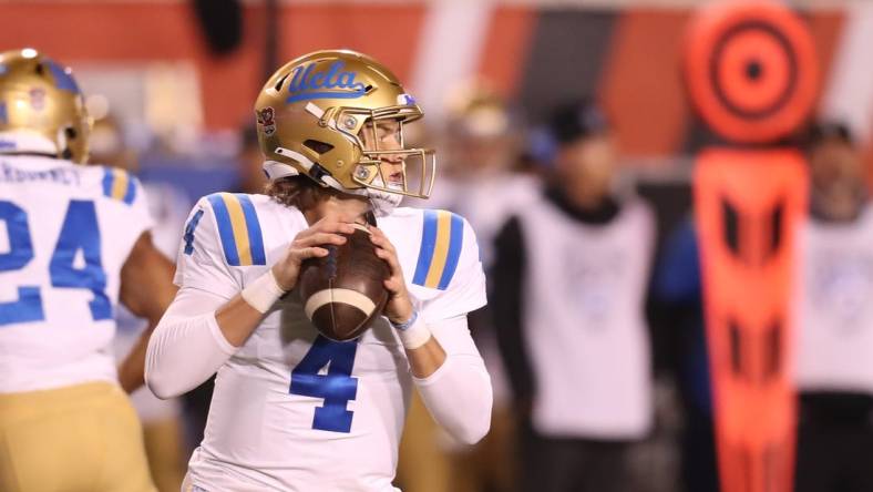 Oct 30, 2021; Salt Lake City, Utah, USA; UCLA Bruins quarterback Ethan Garbers (4) drops back to pass the ball during the first quarter against the Utah Utes at Rice-Eccles Stadium. Mandatory Credit: Rob Gray-USA TODAY Sports