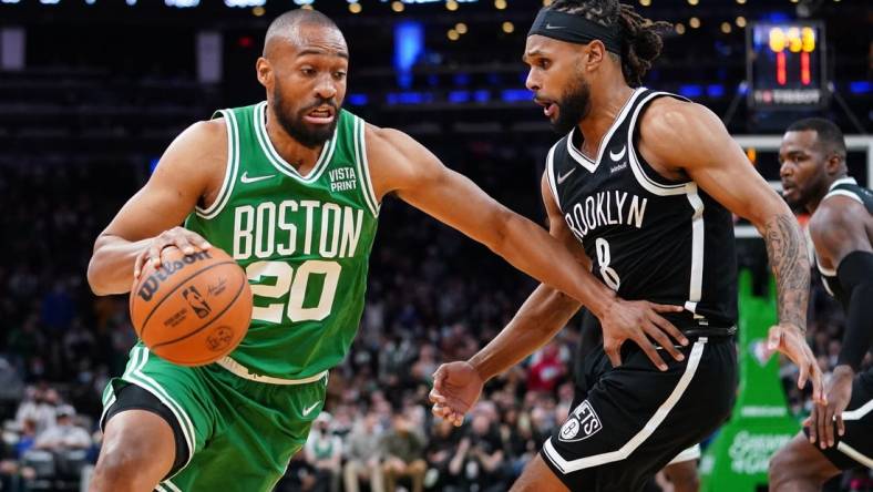 Nov 24, 2021; Boston, Massachusetts, USA; Boston Celtics forward Jabari Parker (20) drives the ball against Brooklyn Nets guard Patty Mills (8) in the second half at TD Garden. Mandatory Credit: David Butler II-USA TODAY Sports