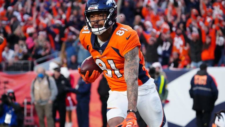 Dec 19, 2021; Denver, Colorado, USA; Denver Broncos wide receiver Tim Patrick (81) celebrates his touchdown reception in the third quarter against the Cincinnati Bengals at Empower Field at Mile High Mandatory Credit: Ron Chenoy-USA TODAY Sports