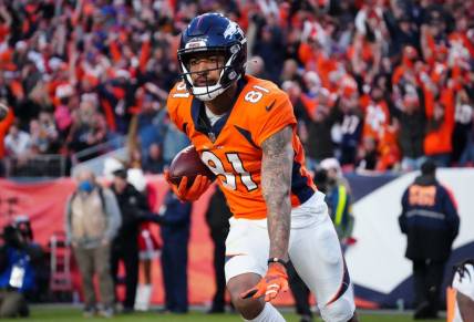 Dec 19, 2021; Denver, Colorado, USA; Denver Broncos wide receiver Tim Patrick (81) celebrates his touchdown reception in the third quarter against the Cincinnati Bengals at Empower Field at Mile High Mandatory Credit: Ron Chenoy-USA TODAY Sports
