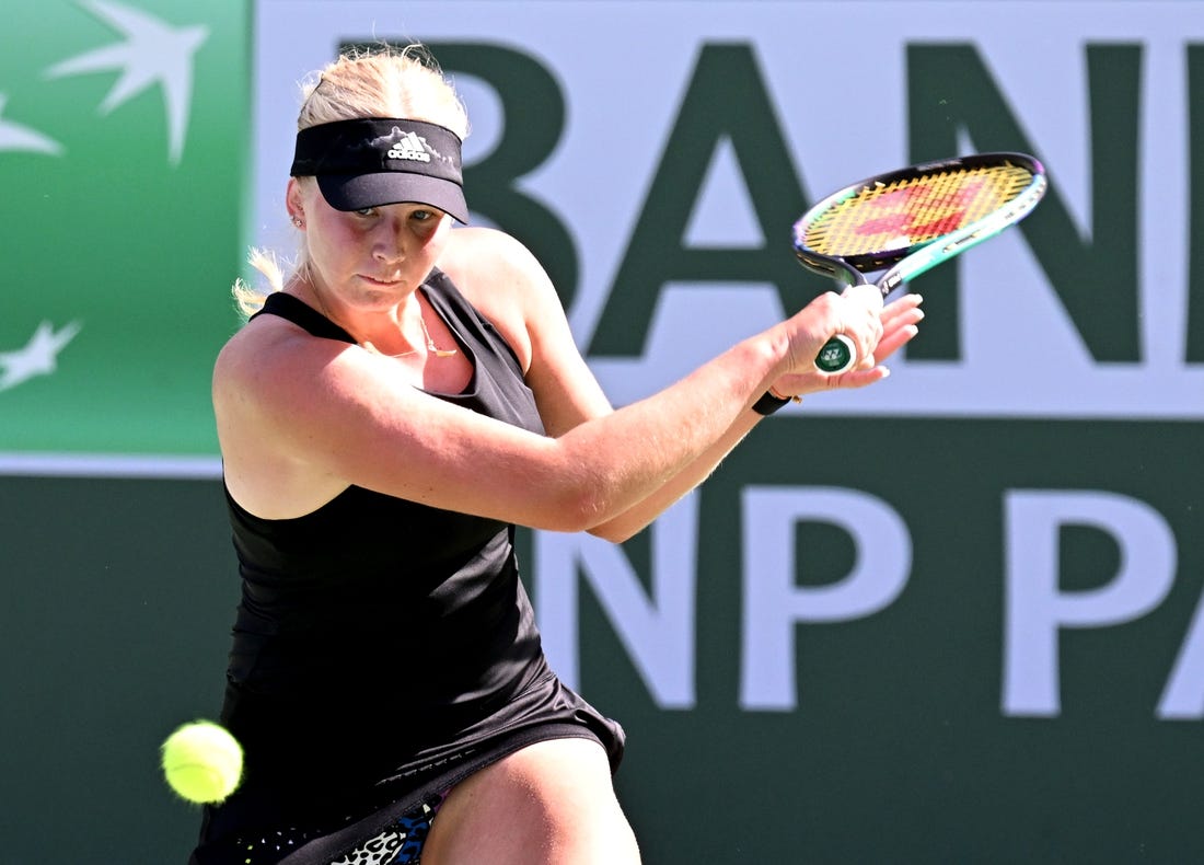 Mar 13, 2022; Indian Wells, CA, USA; Clara Tauson (DEN) hits a shot during her third round match against  Iga Swiatek (POL)at the BNP Paribas Open at the Indian Wells Tennis Garden. Mandatory Credit: Jayne Kamin-Oncea-USA TODAY Sports