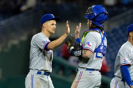 May 3, 2022; Philadelphia, Pennsylvania, USA; Texas Rangers shortstop Corey Seager (5) and catcher Jonah Heim (28) high five after a victory against the Philadelphia Phillies at Citizens Bank Park. Mandatory Credit: Bill Streicher-USA TODAY Sports
