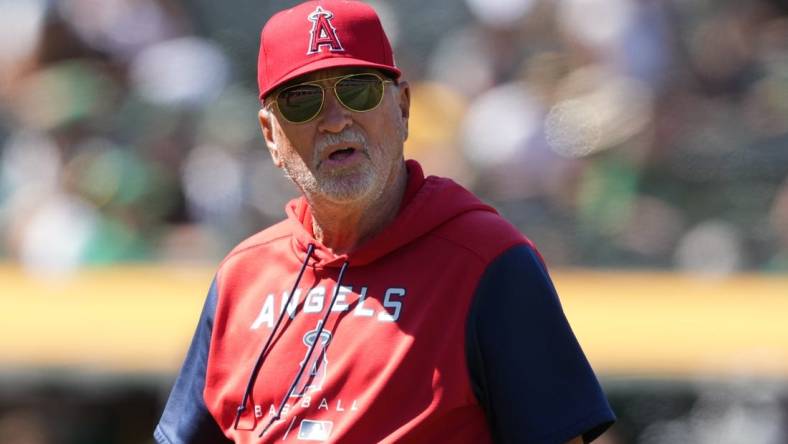 May 14, 2022; Oakland, California, USA; Los Angeles Angels manager Joe Maddon (70) walks to the dugout during the seventh inning against the Oakland Athletics at RingCentral Coliseum. Mandatory Credit: Darren Yamashita-USA TODAY Sports