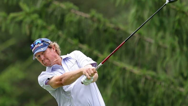 Tim Petrovic sends his ball down the fairway on the 13th hole during second round of the Bridgestone Senior Players Tournament at Firestone Country Club on Friday.

Bridgestonejl 6