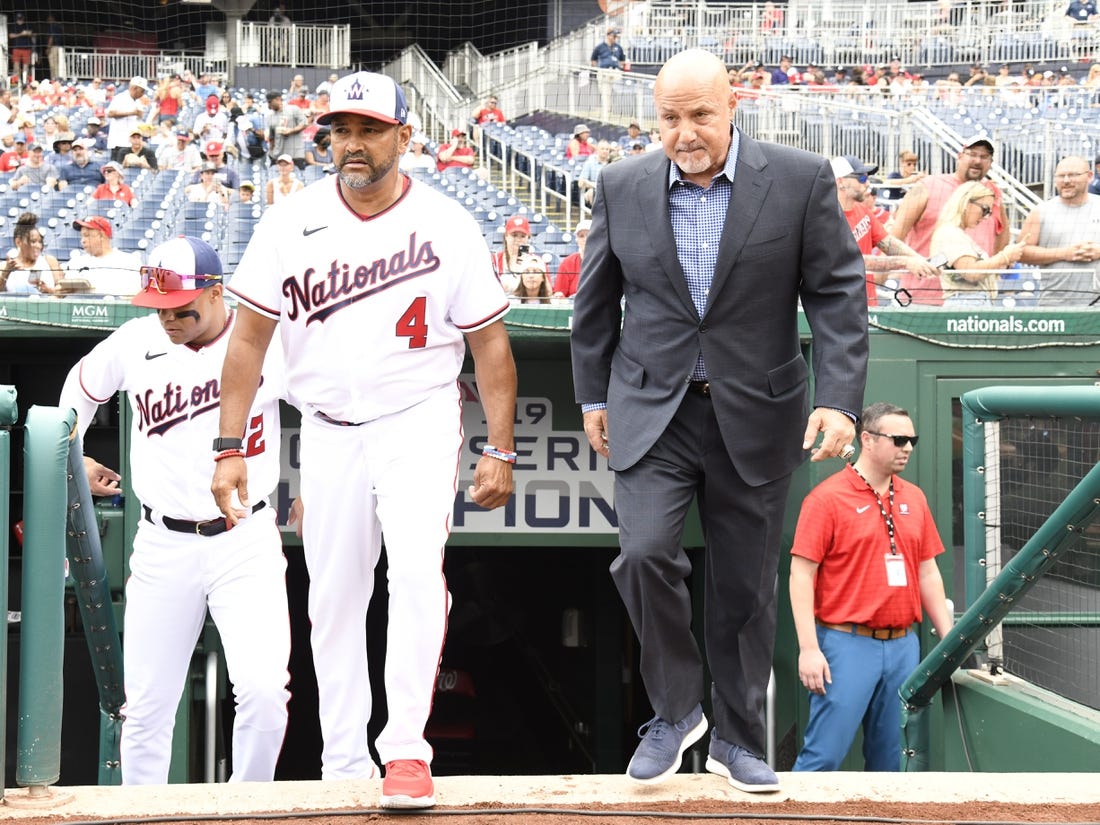 Jul 17, 2022; Washington, District of Columbia, USA;  Washington Nationals manager Dave Martinez (4) and general manager Mike Rizzo (right) step onto the field for a pre-game ceremony at Nationals Park. Mandatory Credit: James A. Pittman-USA TODAY Sports