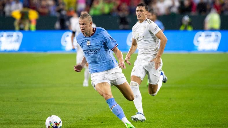 Manchester City forward Erling Haaland (9) runs the ball during the exhibition match against FC Bayern Munich on Saturday, July 23, 2022, at Lambeau Field in Green Bay, Wis.

Gpg Bayern Man City Match 7232022 0014