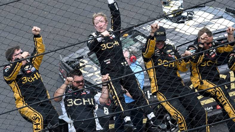 NASCAR Cup Series driver Tyler Reddick (8) and his team climb the fence Sunday, July 31, 2022, after winning the Verizon 200 at the Brickyard at Indianapolis Motor Speedway.

MAIN IMAGE 073122 Nascarverizon200 0027