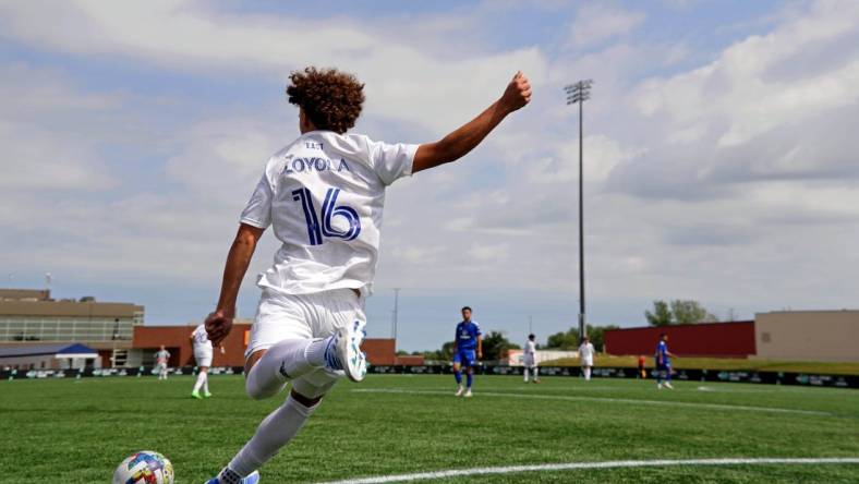 Aug 10, 2022; Blaine, MN, USA; MLS Next East player Favian Loyola (16) of Orlando City takes a corner kick against MLS Next West during the second half of the 2022 MLS NEXT All-Star Game at National Sports Center Indoor Sports Hall. Mandatory Credit: Kirby Lee-USA TODAY Sports