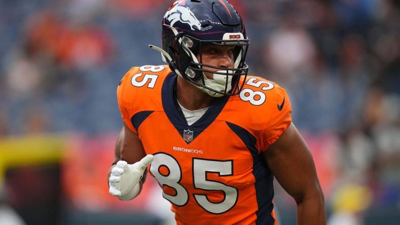 Aug 13, 2022; Denver, Colorado, USA; Denver Broncos tight end Albert Okwuegbunam (85) warms up before the preseason game against the Dallas Cowboys at Empower Field at Mile High. Mandatory Credit: Ron Chenoy-USA TODAY Sports