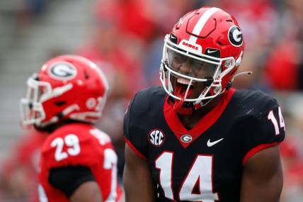 Georgia's Arik Gilbert (14) celebrates after making a touchdown catch during the G-Day spring game in Athens, Ga., on Saturday, April 16, 2022.

News Joshua L Jones

Syndication Online Athens