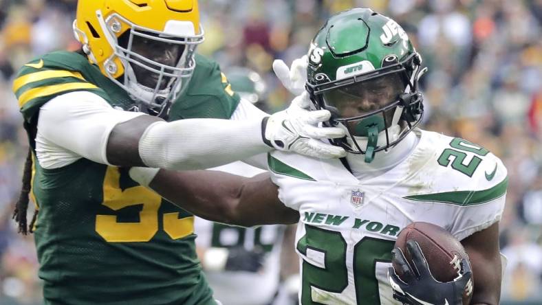 Oct 16, 2022; Green Bay, Wisconsin, USA; Green Bay Packers linebacker De'Vondre Campbell (59) chases New York Jets running back Breece Hall (20) during the second half at Lambeau Field. Mandatory Credit: Wm. Glasheen/Appleton Post-Crescent-USA TODAY NETWORK