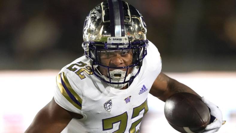 Oct 22, 2022; Berkeley, California, USA; Washington Huskies running back Cameron Davis (22) carries the ball against the California Golden Bears during the third quarter at FTX Field at California Memorial Stadium. Mandatory Credit: Darren Yamashita-USA TODAY Sports