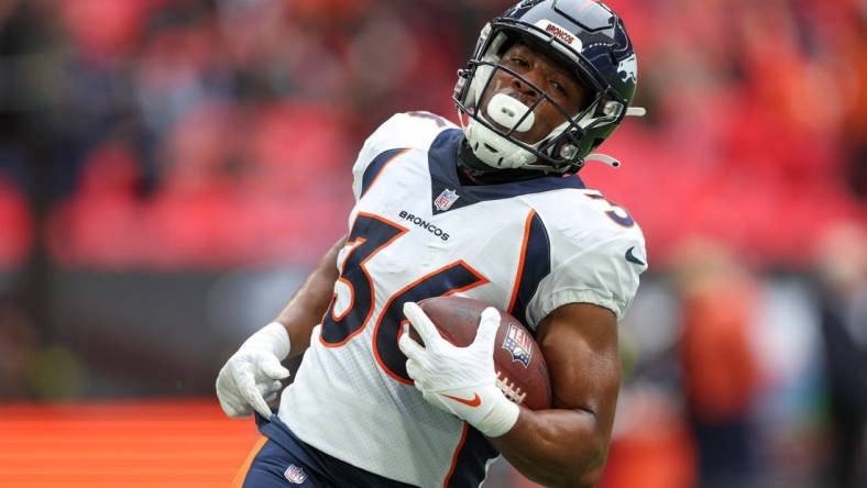 Oct 30, 2022; London, United Kingdom, Denver Broncos running back Devine Ozigbo (36) warms up before a game against the Jacksonville Jaguars during an NFL International Series game at Wembley Stadium. Mandatory Credit: Nathan Ray Seebeck-USA TODAY Sports